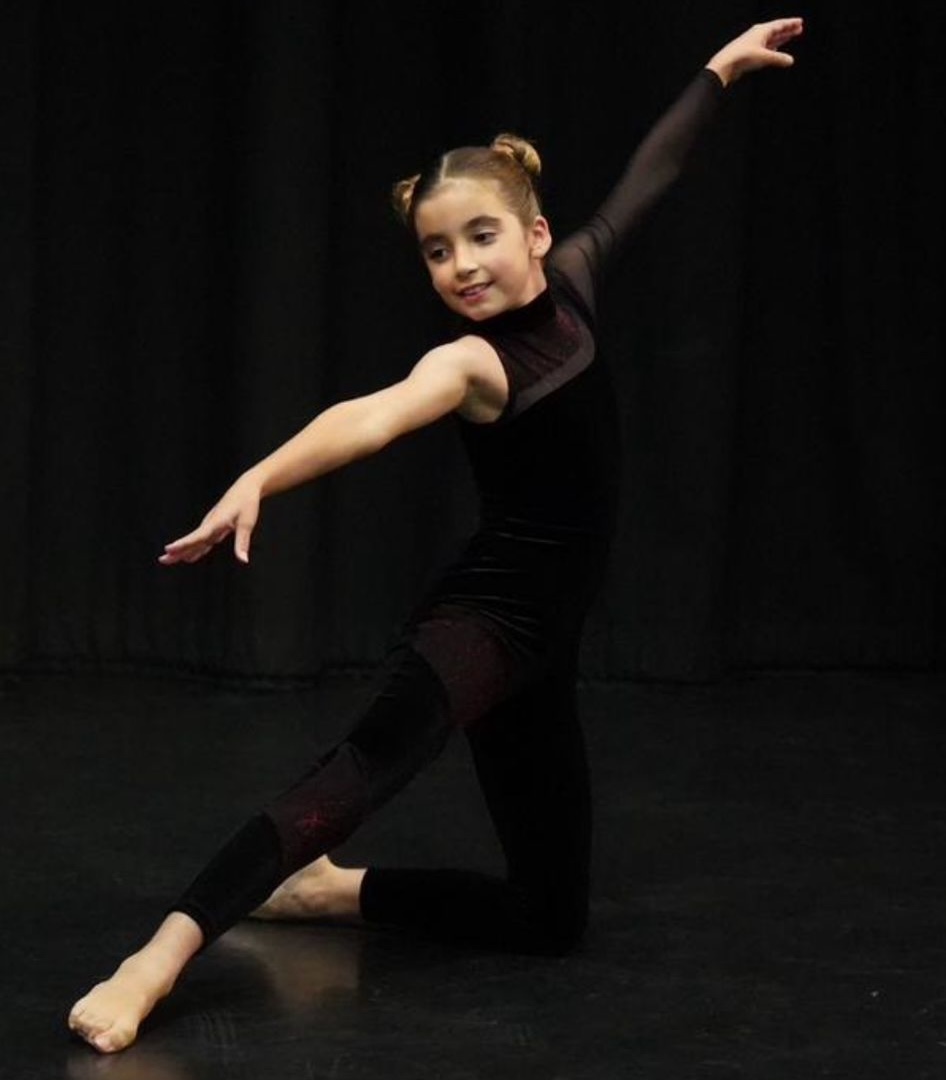 a girl in a dance pose
